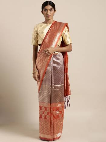 Celebrate This Festive Season In Traditional Look Wearing This Silk?Based Saree In Orange And Purple Color. This Saree And Blouse are Fabricated On Banarasi Art Silk Beautified With Weave All Over