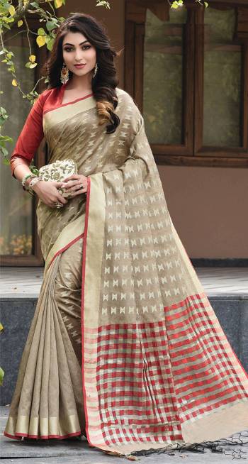 Add This Pretty Simple And Elegant Looking Silk Based Saree In Beige Color Paired With Contrasting Red Colored Blouse. This Saree And Blouse Are Fabricated On Art Silk Beautified With Weave All Over. 