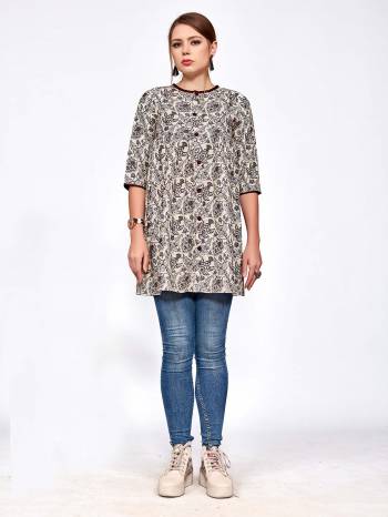 For Your College, Home Or Work Place, Grab This Designer Readymade Top In Cream And Black Color Beautified With Small Prints All Over It. It Is Light In Weight And Easy To Carry All Day Long. 