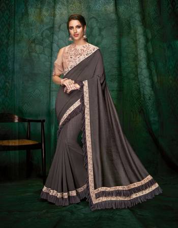 Stylish and complimenting, this saree with a cold-shoulder hand embroidered blouse complimented with just the right amount of frills will instantly connect you with your chic side