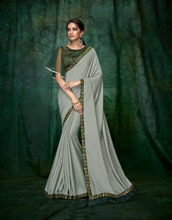 Exude modern splendour and savour the glorious details in this flared sleeves, hand embroidered blouse with subtle hues . 