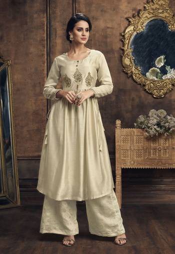 Rich And Elegant Looking Designer Readymade Set Of Kurti And Plazzo Is Here In Cream Color. Its Soft Silk Based Top Is Beautified With Embroidery Paired With Soft Silk Based Foil Printed Bottom. 