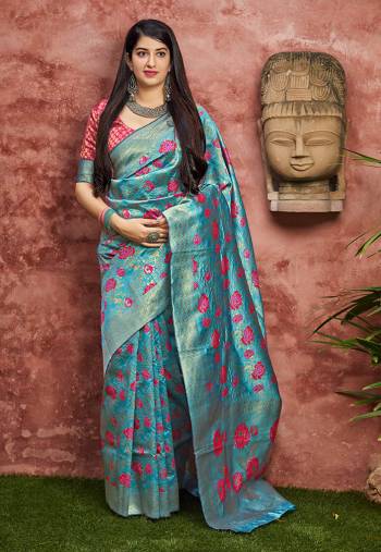 Grab This Pretty Silk Based Saree For The Upcoming Festive And Wedding Season In Blue Color Paired With Contrasting Dark Pink Colored Blouse. This Saree And Blouse Are Fabricated On Banarasi Art Silk Beautified With Weave All Over. 