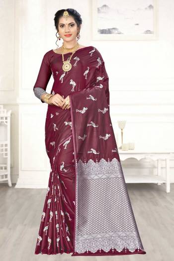 Enhance Your Personality Wearing This Designer Silk Based Saree In Maroon Color Paired With Maroon Colored Blouse. This Saree And Blouse Are Fabricated On Banarasi Art Silk Beautified With Pretty Motif Weave. 