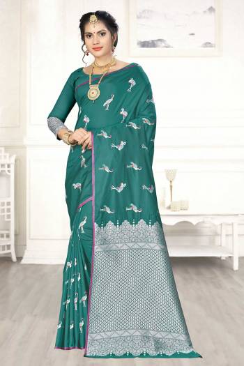 Enhance Your Personality Wearing This Designer Silk Based Saree In Teal Green Color Paired With Teal Green Colored Blouse. This Saree And Blouse Are Fabricated On Banarasi Art Silk Beautified With Pretty Motif Weave. 