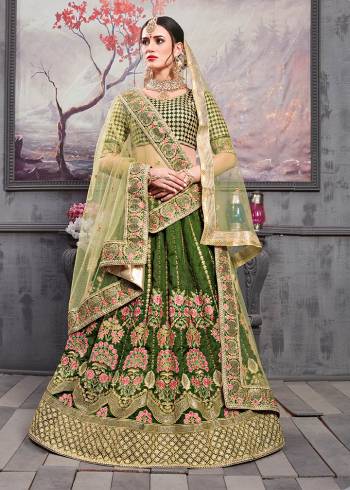 Get Ready For The Upcoming Wedding Season With This Heavy Designer Lehenga Choli In Dark Green Color Paired With Pastel Green Colored Dupatta. Its Heavy Embroidered Blouse And Lehenga Are Fabricated On Art Silk Paired With Net Fabricated Dupatta. Its Beautiful Color And Contrasting Embroidery Gives An Attractive Look To It. 