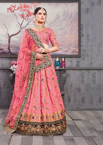 Grab This Very Beautiful Heavy Designer Lehenga Choli For The Wedding Season In All Over Pink Color. This Pretty Embroidered Lehenga Choli Is Fabricated On Banarasi Art Silk Paired With Net Fabricated Dupatta. Also It Is Light In Weight And Ensures Superb Comfort All Day Long. 