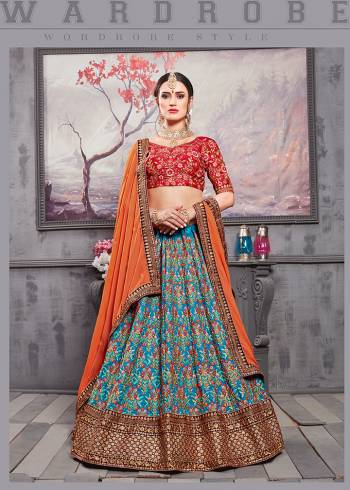 Go Colorful Wearing This Heavy Designer Lehenga Choli In Red Colored Blouse Paired With Blue Colored Lehenga And Orange Colored Dupatta. Its Blouse And Lehenga Are Fabricated On Banarasi Art Silk Paired With Net Fabricated Dupatta. Buy This Attractive Looking Lehenga Choli Now.