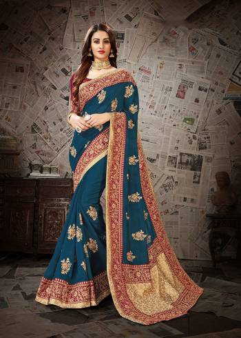 Pretty Attractive Color Pallete IS Here With This Heavy designer Saree In Blue Color Paired With Contrasting Maroon Colored Blouse .This Saree And Blouse Are Silk Based Beautified With Heavy Embroidery Work. Buy This Saree Now.