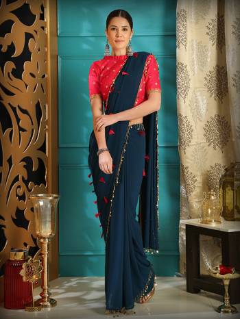 You Will Definitely Earn Lots Of Compliments Wearing This Designer Saree In Navy Blue Color Paired With Contrasting Dark Pink Colored Blouse. This Saree Is Fabricated On Georgette Paired With Art Silk Fabricated Blouse. Its Minimal Embroidery Will Give Your Personality A Look Like Never Before. 