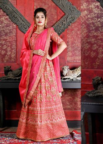 Bright And Visually Appealing Color Is Here With This Heavy Designer Lehenga Choli In All Over Dark Pink Color. Its Blouse And Lehenga Are Fabricated on Art Silk Paired With A Net Fabricated Dupatta And A Silk Based Shawl. The Shawl Look With The Lehenga Is Very Trending Nowadays. Buy Now.