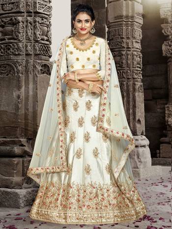 Grab This Very Beautiful And Elegant Looking Designer Lehenga Choli In All Over Cream Color. Its Blouse Is Fabricated On Art Silk Paired With Satin Silk Fabricated Lehenga And Net Fabricated Dupatta. It Is Beautified With Jari And Resham Embroidery With Stone Work. Buy Now.