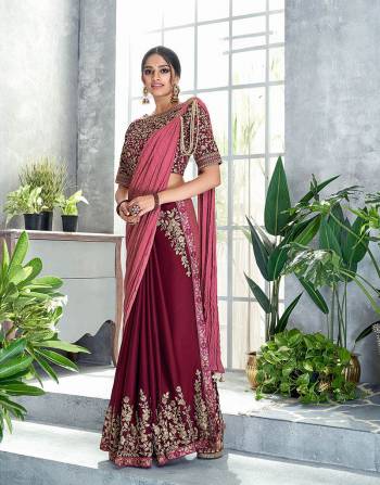 Romantic maroon pre-pleated saree with pearl details and exclusive delicate floral embroidery placement will be a perfect festive pick this season. 