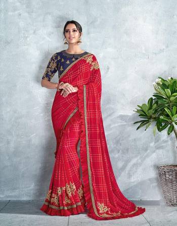 A classic red self-checkered saree with embroidered butta placements, crush frills and peter-pan collared blouse makes for a trendy, sassy and interesting pick this festive season.