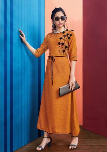 New Shade In Long Readymade Kurti Is Here In Rust Orange Color Fabricated On Rayon Slub. This Kurti Is Beautified With Thread Work And Tassels And Availble In All Regular Sizes. 