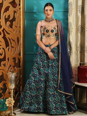 You Will Definitely Earn Lots Of Compliments Wearing This Heavy Designer Lehenga Choli In Embroiderd Beige Colored Blouse Paired With Navy Blue Colored Lehenga And Dupatta. Its Blouse Is Silk Based Paired With Jacquard Silk Lehenga And Net Fabricated Dupatta. 