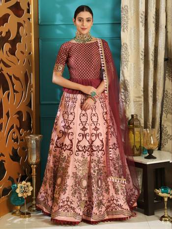 Look Pretty In This Lovely Color Pallete Of Deisgner Lehenga Choli In Maroon And Pink Color. This Lehenga Choli Is Fabricated On Art Silk Paired With Net Fabricated Dupatta. It Is Beautified With Prints And Embroidery Making It More Attractive. 