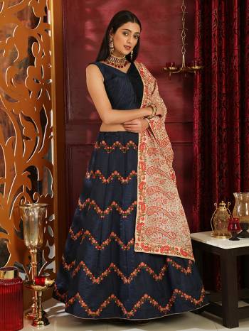 Quite Unique Patterned Designer Lehenga Choli Is Here In Navy Blue Color Paired With Cream Colored Dupatta. Its Blouse And Lehenga are Fabricated On Art Silk Paired With Georgette Fabricated Heavy Kashmiri Embroidered Dupatta. 