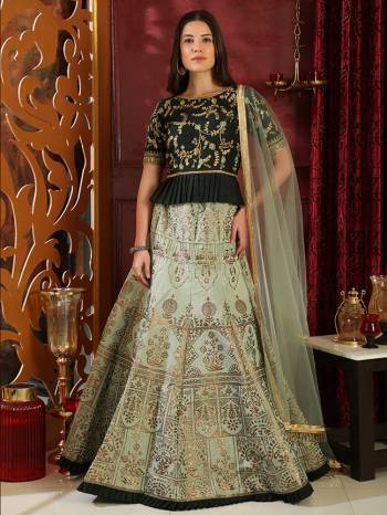 Go With The Lovely Shades Of Green With This Heavy Designer Lehenga Choli In Dark Green Colored Blouse Paired With Pastel Green Colored Lehenga And Dupatta. This Pretty Lehenga And Choli Are Fabricated On Art Silk Paired With Net Fabricated Dupatta. 