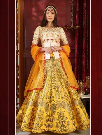 Get Ready For This Festive And Wedding Season With This Very Beautiful Heavy Designer Lehenga Choli In Cream And Yellow Color. This Pretty Lehenga Choli Is Silk Based Paired With Net Fabricated Dupatta. Its Fabrics Are Light Weight And Ensures Superb Comfort Throughout The Gala. 