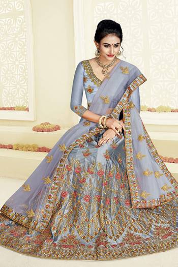 Grab This Very Beautiful And Elegant Looking Designer Lehenga Choli In All Over Grey Color. Its Blouse Is Fabricated On Art Silk Paired With Satin Silk Fabricated Lehenga And Net Fabricated Dupatta. It Is Beautified With Jari And Resham Embroidery With Stone Work. Buy Now.