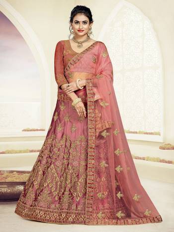 Grab This Very Beautiful And Elegant Looking Designer Lehenga Choli In All Over Old Rose Pink Color. Its Blouse Is Fabricated On Art Silk Paired With Satin Silk Fabricated Lehenga And Net Fabricated Dupatta. It Is Beautified With Jari And Resham Embroidery With Stone Work. Buy Now.