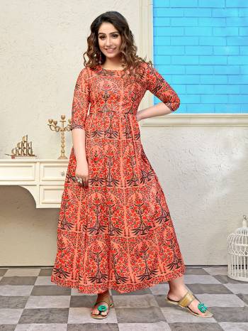 Add Some Semi-Casuals With This Readymade Long Kurti In Orange Color Fabricated Muslin. It Is Beautified With Prints All Over And Is Available In All Regular Sizes. \