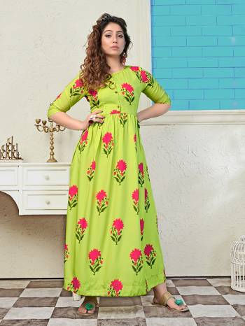 Look Pretty In This Designer Floral Printed Long Kurti In Parrot Green Color. This Readymade Kurti Is Muslin Based And Available In All Regular Sizes.