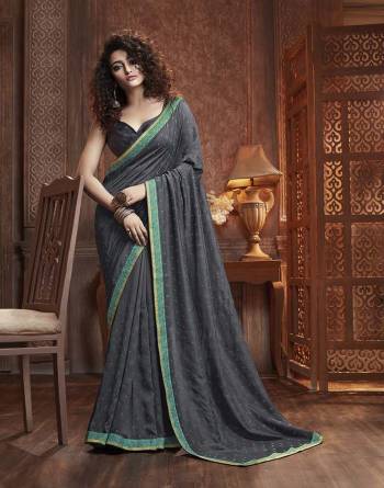 Celebrate This Festive Season With Beauty And Comfort Wearing This Designer Silk Based Saree In Dark Grey Color. This Saree Is Fabricated On Vichitra Silk Paired With Art Silk Fabricated Blouse. It Is Beautified With Itricate Embroidered Butti All Over. Buy This Lovely Saree Now.