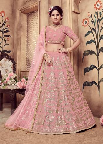 Look Pretty Wearing This Very Beautified Designer Lehenga Choli In All Over Pink Color .This Lehenga Choli IS Fabricated On Art Silk Paired With Net Fabricated Dupatta. It Has Attractive Foil Print And Hand Work Which Will Definitelt Earn You Lots Of Compliments From Onlookers. 