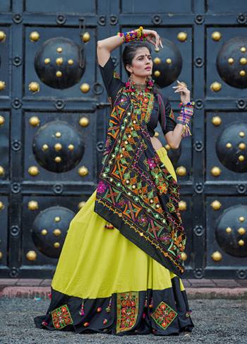 This Navratri, Adorn The Proper Traditional Look Wearing This Designer Lehenga Choli In Black & Pear Green Color. This Pretty Lehenga Choli Is Cotton Based Beautified With Multi Colored Thread Embroidery And Mirror Work. 