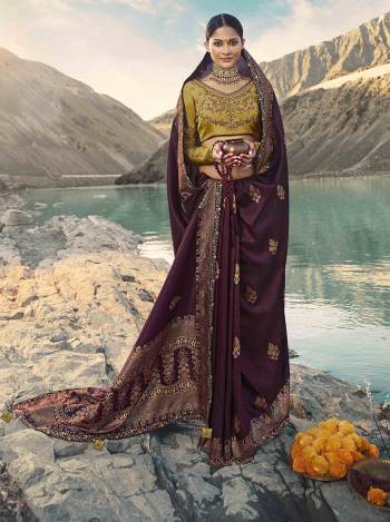 Add This Very Beautiful Designer Saree In Wine Color Paired With Contrasting Pear Green Colored Blouse. This Saree Is Fabricated On Weaving Art Silk Paired With Art Silk Fabricated Blouse. Its Attractive Embroidery And Rich Silk Fabric Will Earn You Lots Of Compliments From Onlookers. 