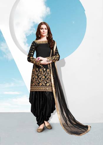 Grab This Attractive Looking Designer Patiala Suit In Black Colored Top , Bottom And Dupatta. Its Top Is Fabricated On Tafeta Silk Beautified With Heavy Jari Embroidery And Mirror Work Paired With Santoon Bottom And Net Fabricated Dupatta. Buy Now.