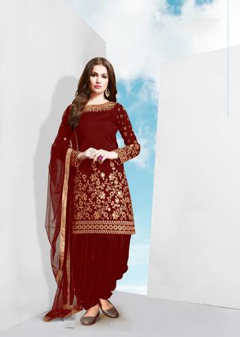 Grab This Attractive Looking Designer Patiala Suit In Red Colored Top , Bottom And Dupatta. Its Top Is Fabricated On Tafeta Silk Beautified With Heavy Jari Embroidery And Mirror Work Paired With Santoon Bottom And Net Fabricated Dupatta. Buy Now.