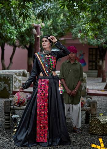 This Navratri, Adorn The Proper Traditional Look Wearing This Designer Lehenga Choli In Black Color. This Pretty Lehenga Choli Is Cotton Based Beautified With Multi Colored Thread Embroidery And Mirror Work