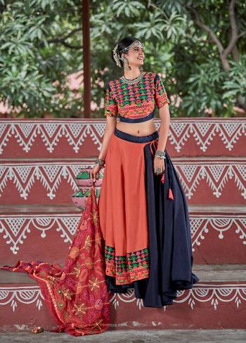 This Navratri, Adorn The Proper Traditional Look Wearing This Designer Lehenga Choli In Navy Blue & Orange Color. This Pretty Lehenga Choli Is Cotton Based Beautified With Multi Colored Thread Embroidery And Mirror Work