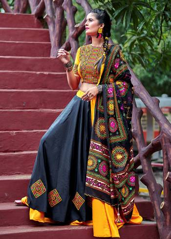 This Navratri, Adorn The Proper Traditional Look Wearing This Designer Lehenga Choli In Yellow And Black Color. This Pretty Lehenga Choli Is Cotton Based Beautified With Multi Colored Thread Embroidery And Mirror Work