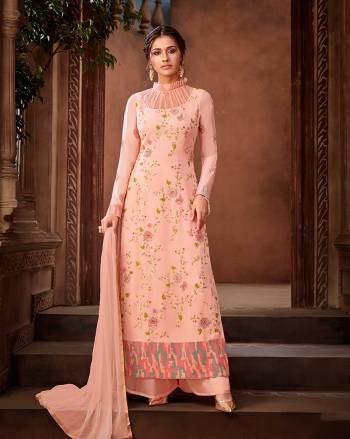 Must Have Shade In Every Womens Wardrobe Is Here With This Designer Straight Suit In All Over Peach Color. Its Lovely Embroidered Top Is Fabricated On Georgette Paired With Santoon Bottom And Chiffon Fabricated Dupatta. 