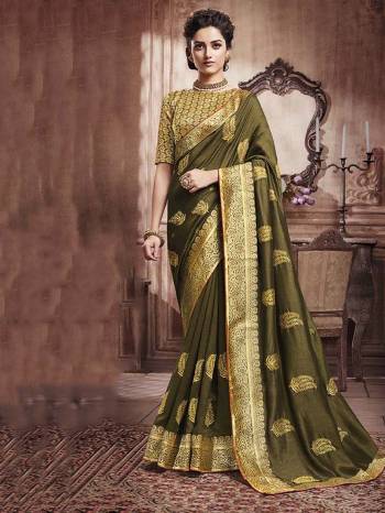 Celebrate This Festive Season With Beauty And Comfort Wearing This Designer Silk Based Saree In Olive Green Color. This Saree And Blouse are Beautified With Attractive Foil Print All Over It, Also It Is Light Weight And Easy To Carry All Day Long