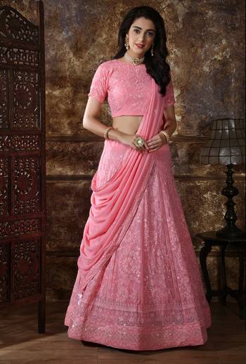 Enhance Your Personality Wearing This Heavy Designer Lehenga Choli In All Over Pink Fabricated Georgette. Its Lehenga Choli And Dupatta Are Beautified With Tone To Tone Thread Embroidery And Sequence Work. Also It Is Light Weight And Comfortable To Carry Throughout The Gala. 