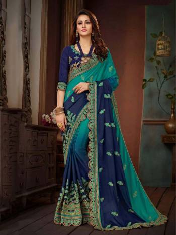 Shaded Saree Can Never Go Out Of Style, Grab This Saree In Shades Of Blue Paired With Navy Blue Colored Blouse. This Saree And Blouse Are Silk Based Beautified With Attractive Embroidery. 