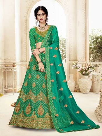 Grab This Heavy Designer Lehenga Choli In All Over Green Color. Its Blouse Is Fabricated On Art Silk Paired With Jacquard Silk Fabricated Lehenga And Net Fabricated Dupatta. It Is Beautified With Weave And Embroidery Which Is Making It More Attractive. 