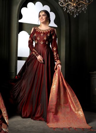 Grab This Very Beautiful Heavy Designer Floor Length Suit In Maroon Color Paired With Contrasting Peach Colored Dupatta. Its Top Is Fabricated On Satin Georgette Paired With Santoon Bottom Paired With Banarasi Art Silk Fabricated Dupatta. It Is Beautified With Embroidery With Over The Yoke And Sleeve. Buy Now