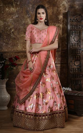 Here Is A Very Pretty Designer Lehenga Choli In Peach Color Its Beautiful And Attractive Looking Blouse And Lehenga Are Fabricated On Art Silk Paired With Orgenza Fabricated Dupatta. It Is Beautified With Foil Print And Embroidery. 