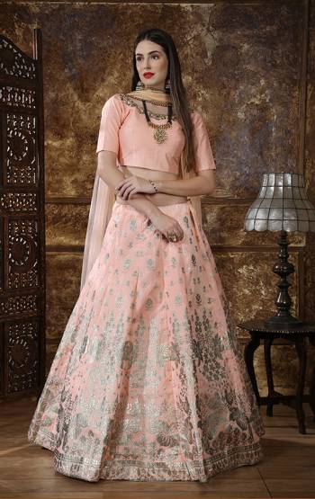 This Season About Subtle Shades And Pastel Play, So Grab Very Pretty Designer Lehenga Choli In Pastel Peach Color. This Lehenga Choli Is Fabricated On Art Silk Paired With Net Fabricated Dupatta. It Is Beautified With Foil Print And Embroidery. 