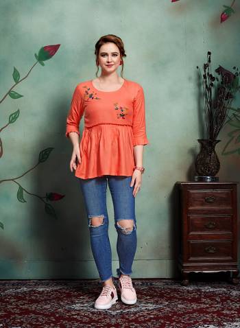 For Your College Wear Or Work Place, Grab This Designer Readymade Top In Orange Color Fabricated On Rayon Beautified With Contrasting Thread Work. It Is Availble In all Regular Sizes. Buy Now.