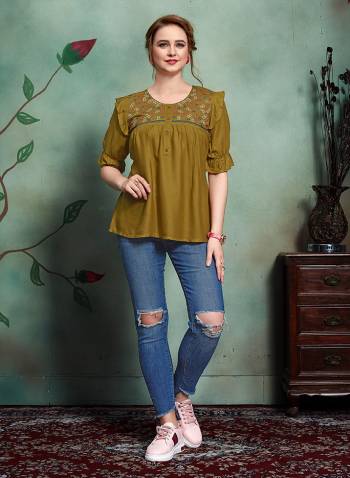 New Shade In Top Is Here With This Designer Readymade Top In Olive Green Color Fabricated On Rayon. It Is Beautified With Few patterns and Thred Work. 