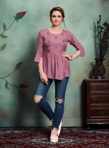 Add This very Pretty Readymade Top In Onion Pink Color Fabricated On Rayon. Its pretty Color And Minimal Embroidery Will Earn You Lots Of Compliments From Onlookers. 