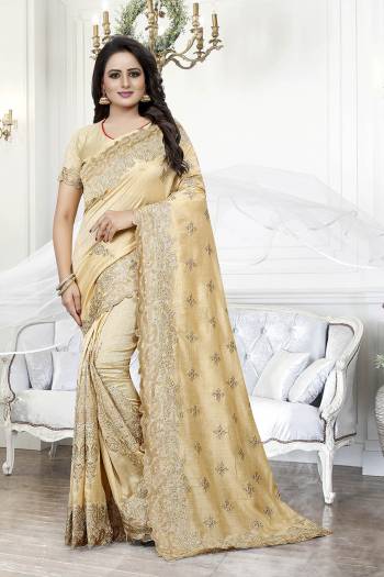 Get Ready For The Upcoming Wedding Season With This Heavy Designer Saree In Cream Color. This Saree And Blouse are Silk Based Beautified With Heavy Embroidery With Cut Work. This Saree Is Suitable For Wedding And Festive Wear. Buy This Heavy Attractive Saree Now.