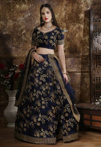 Enhance your Personality Wearing This Heavy Designer Lehenga Choli In All Over Navy Blue Color. Its Blouse And Lehenga are Silk Based Paired With net Fabricated Dupatta. Buy This Pretty Designer Piece Now. 